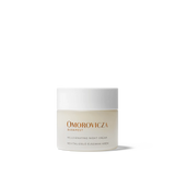 
  
  Omorovicza Rejuvenating Night Cream comes in a frosted glass compact jar with black branding text and a white screw-on top.
  
