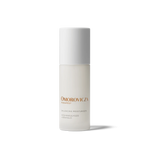 
  
  The Omorovicza Balancing Moisturizer comes in a frosted glass bottle with black branding text and a white screw-on top.
  
