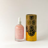 
  
  Textured glass bottle of Cult + King's Jelly with a white eyedropper top beside its cylindrical cardboard and black box.
  
