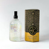 
  
  Textured glass bottle of Cult + King SUPERWATER Toner with black atomizer, beside its hexagonal cardboard and black box.
  
