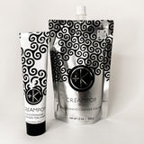 
  
  Cult + King CREAMPOP Cleansing Conditioner in a black-and-white swirl-patterned squeeze tube, beside its silver refill pouch.
  
