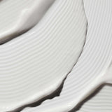 
  
  Close-up of the Omorovicza Illuminating Moisturizer showing its velvety white color and rich consistency.
  

