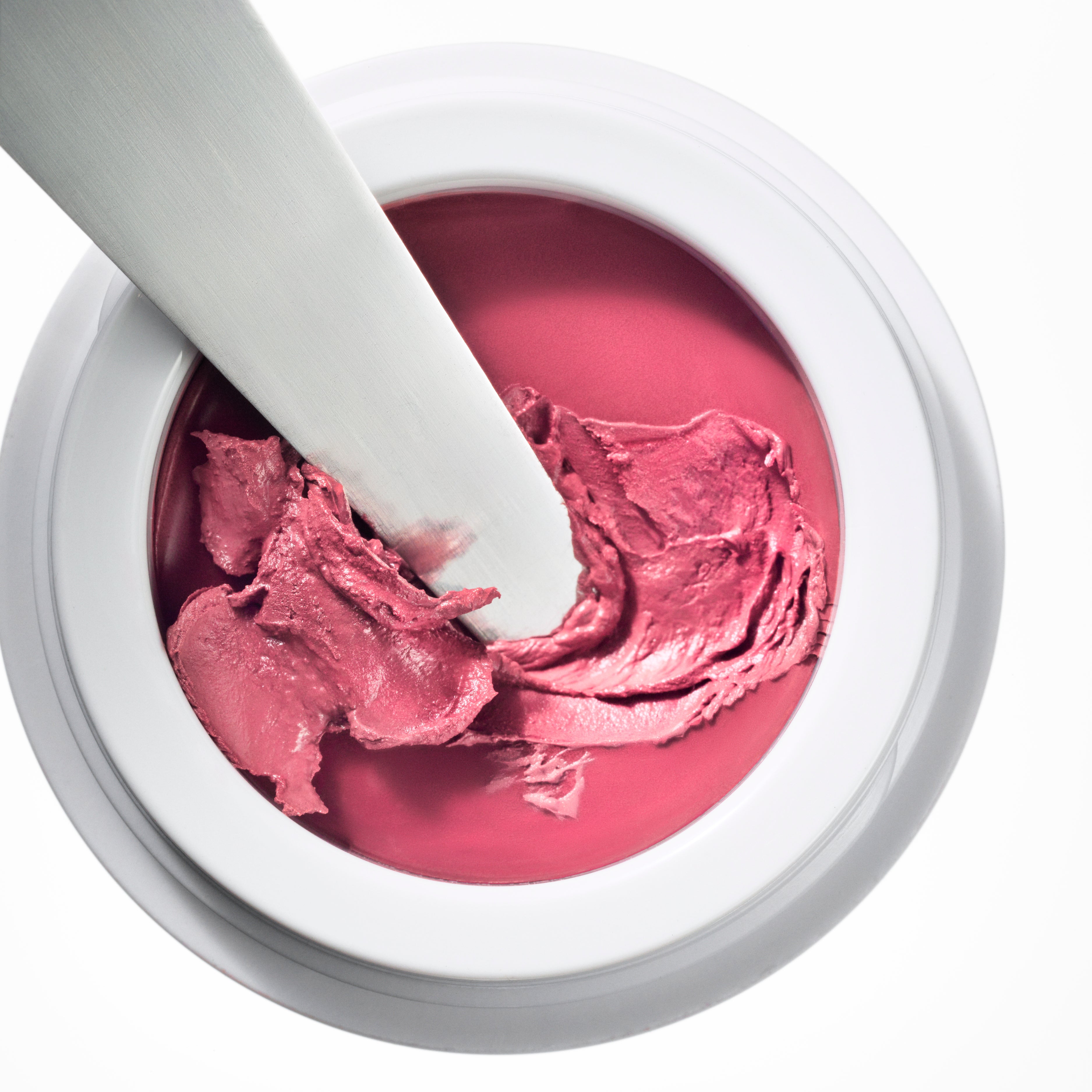
  
  Manasi 7 All Over Colour dianthus in its white compact jar with a makeup brush dipped inside.
  
