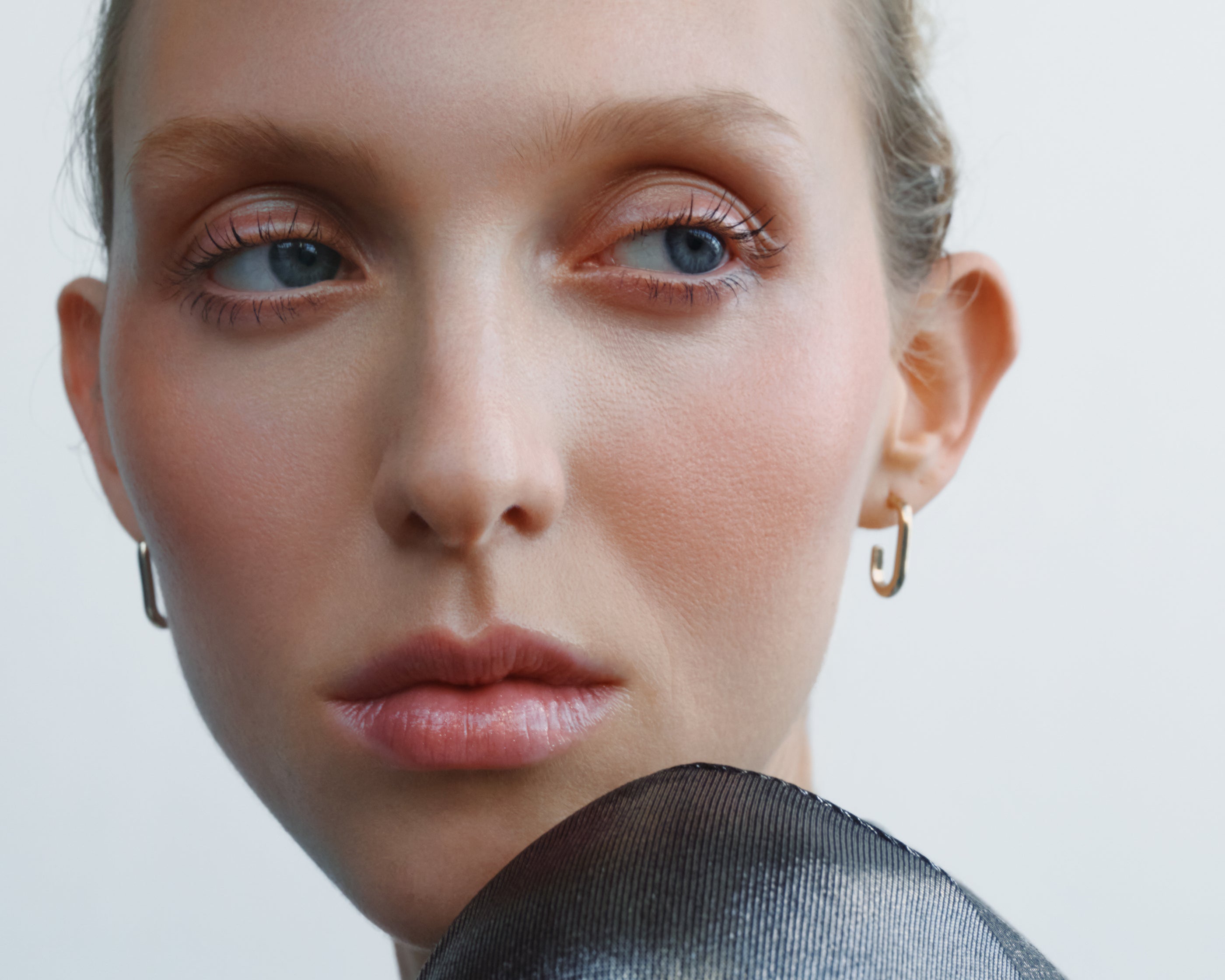 
  
  Close-up of a model wearing Chameli Tinted Potion on lips, cheeks, and eyes
  

