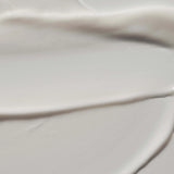 
  
  Close-up of the Omorovicza Reviving Eye Cream showing its rich, creamy consistency and a white color.
  
