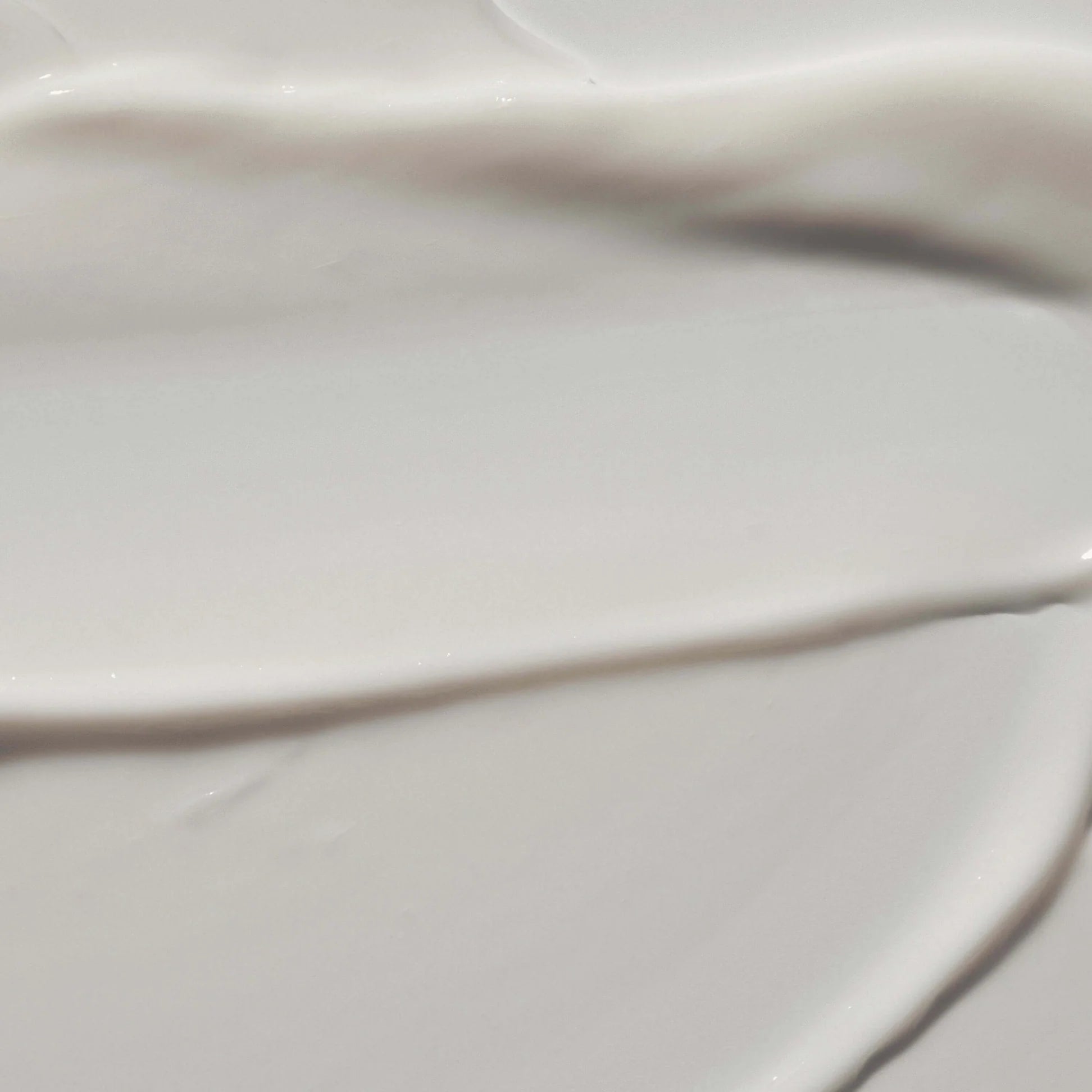 
  
  Close-up of the Omorovicza Reviving Eye Cream showing its rich, creamy consistency and a white color.
  
