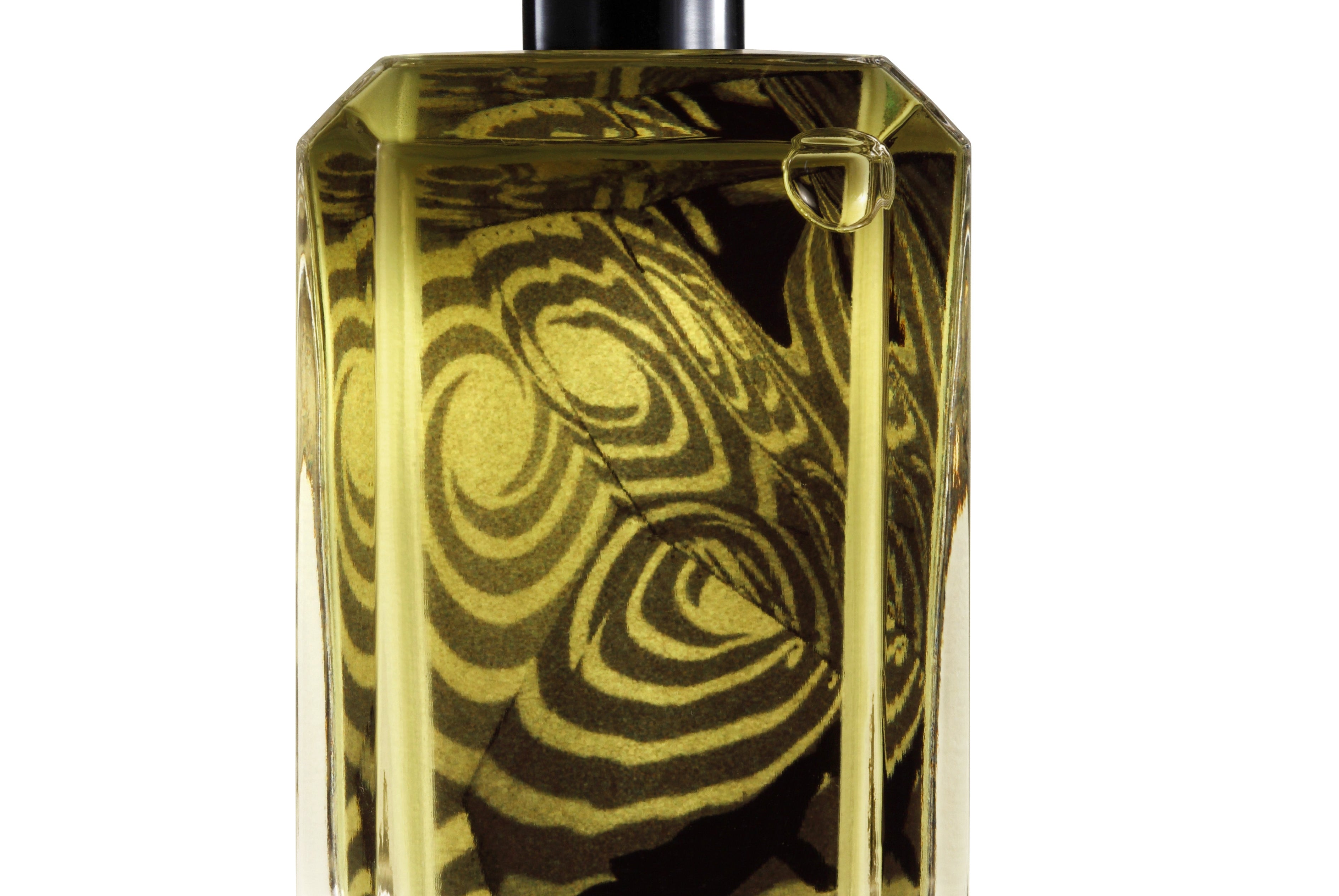 
  
  perfume bottle showing its liquid with marbled floral backdrop behind the logo sticker.
  
