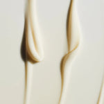 
  
  A close-up view shows the rich velvety consistency and cream color of Omorovicza's Cushioning Day Cream.
  
