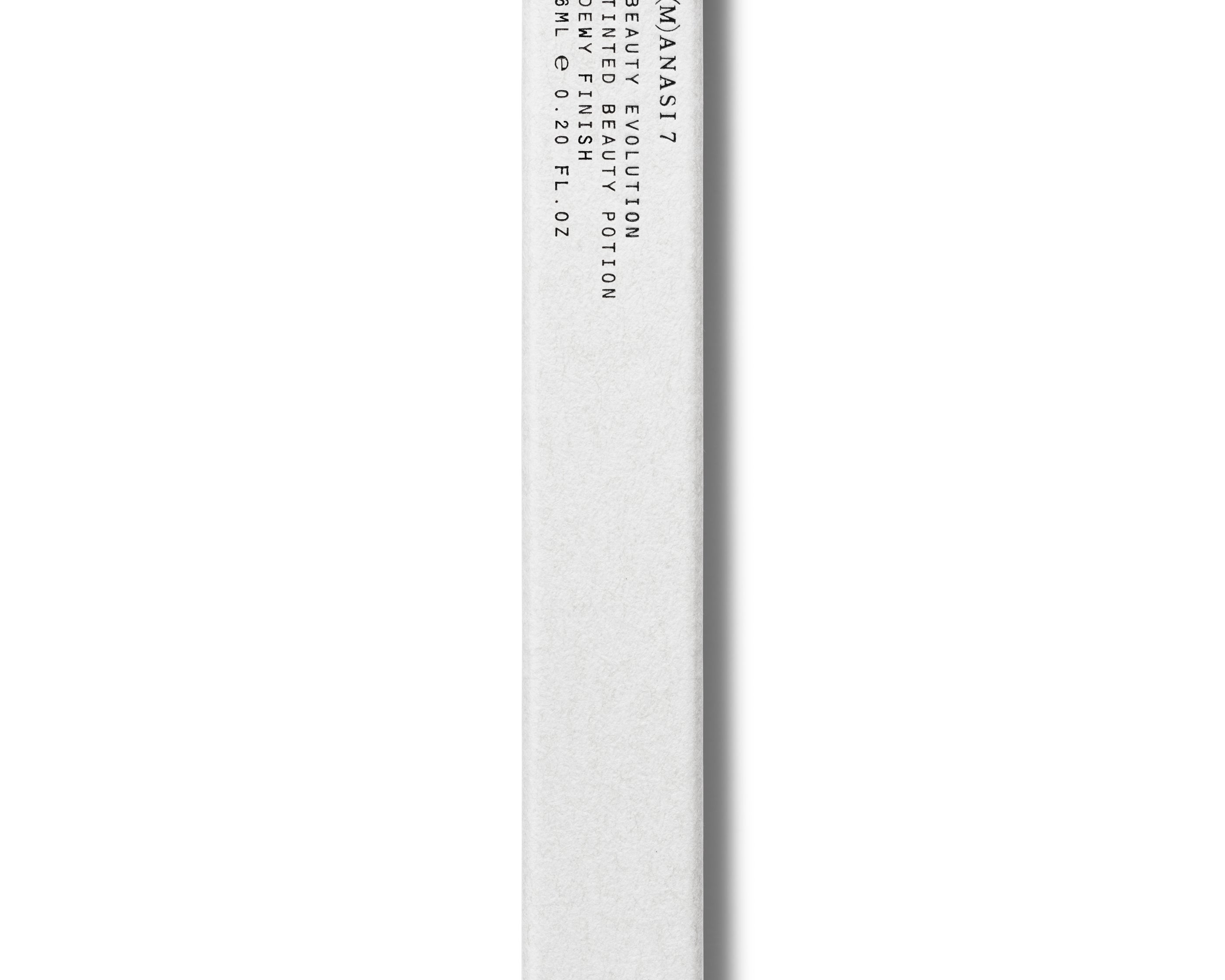 
  
  A slim, white rectangular box with black printed text, including the brand name Manasi 7 Tinted Potion Product, shown vertically on a white background.
  
