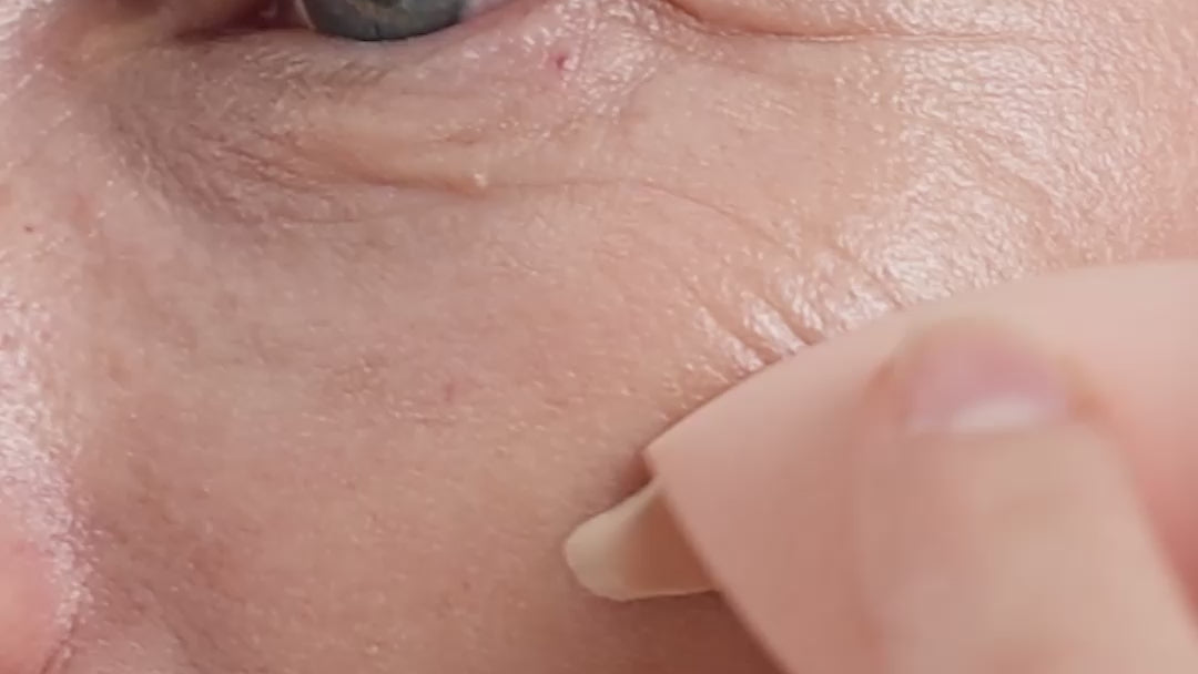 
  
  Oatmilk Foundation Latte, a fair to light flexible foundation shade, where model is applying the foundation and showing the finish.
  
