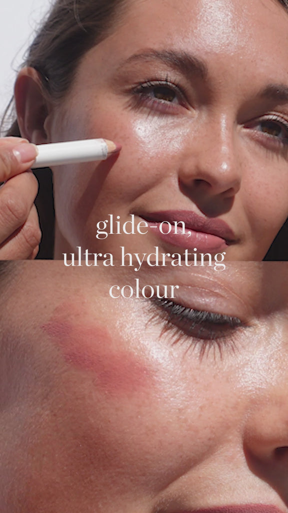 Person applying Ere Perez Coco Crayon to face.